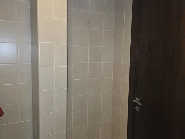Original bathroom corridor before renovation, Deema villa renovation in Dubai
