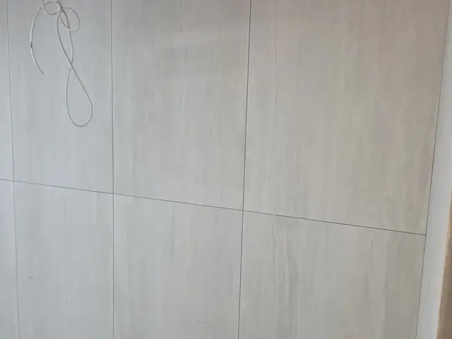 Wall tiling with plumbing rough-in for wall-hung fixtures