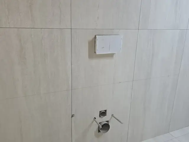 Wall tiling with plumbing rough-in before fixture installation