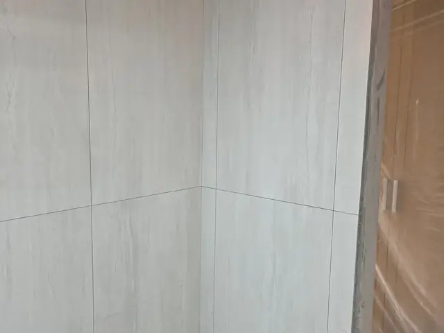 Bathroom corner tiling with plumbing points marked