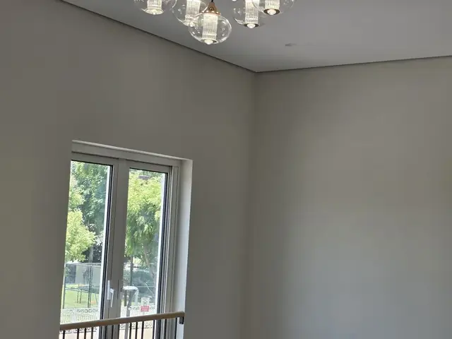 Finished room with chandelier installation