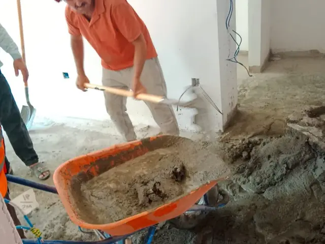 Fixmania team mixing cement on site