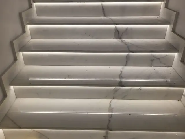 Marble staircase with integrated LED step lighting