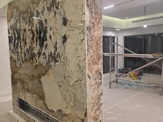 Granite feature column installation in villa living room