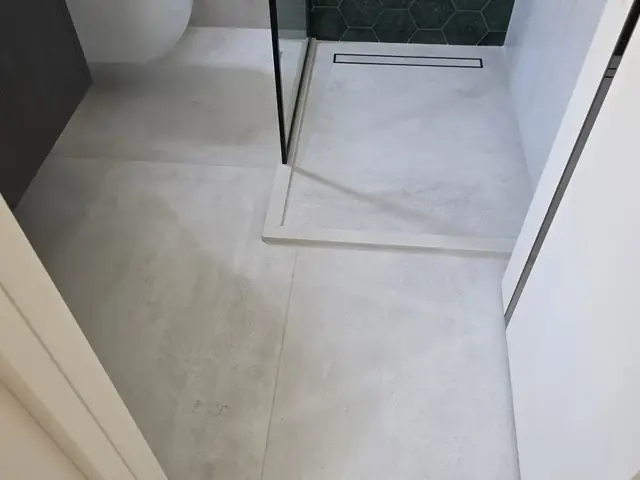 Bathroom flooring and walk-in shower finish