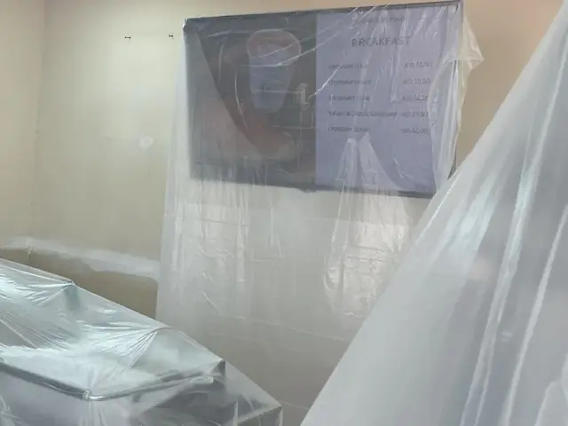 Wall finishing and paint touch-up at café