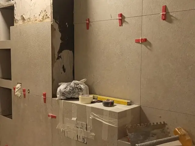 Bathroom wall and floor tiling in progress