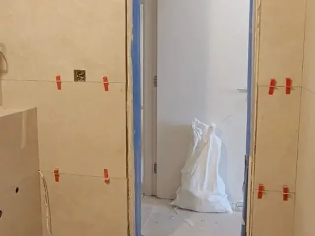 Doorway tiling installation in progress