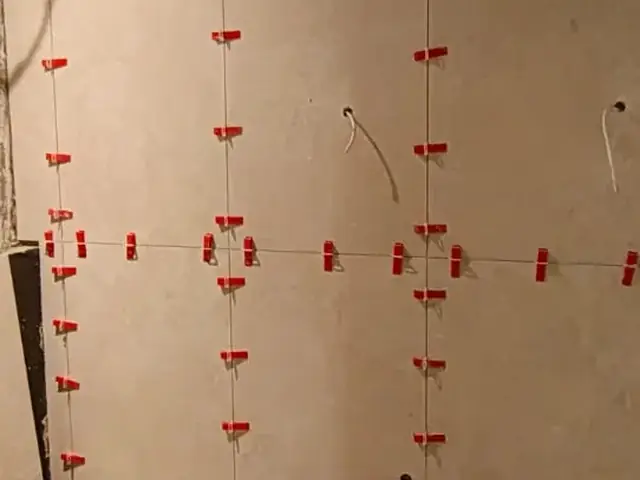 Bathroom wall tiling installation in progress