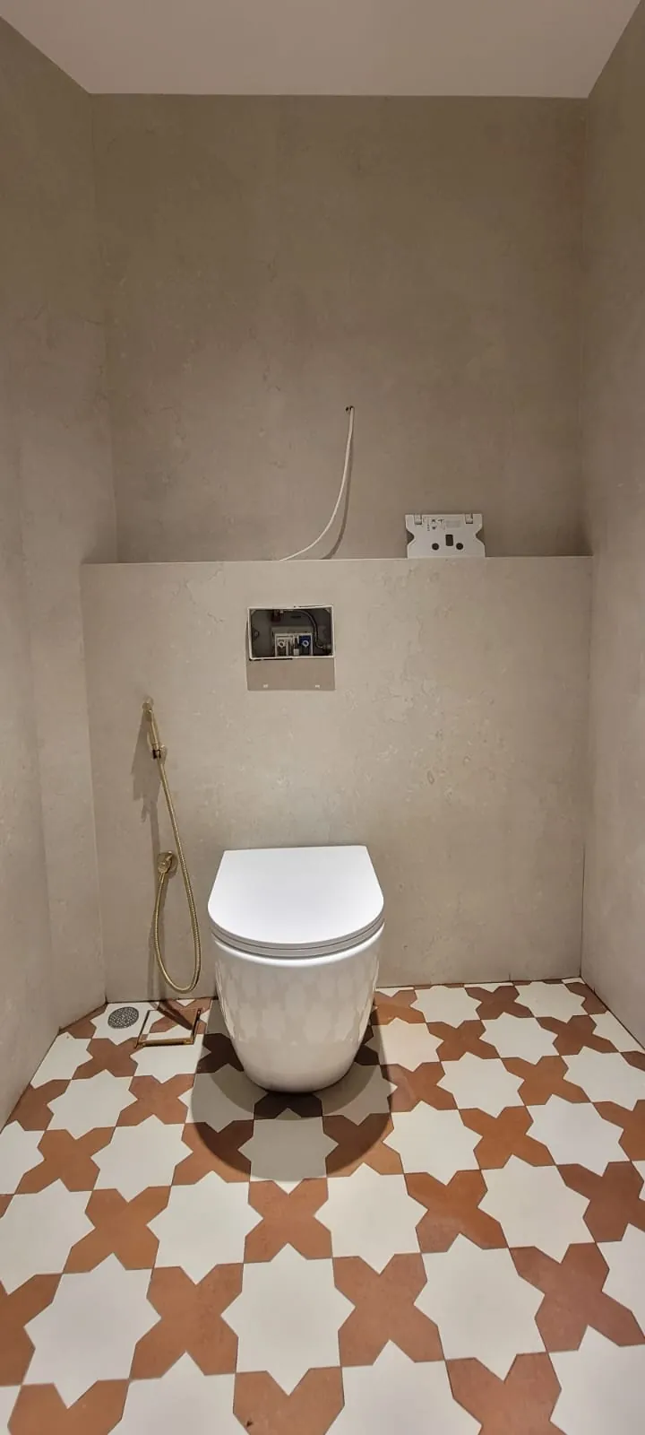 Finished powder room with Moroccan star pattern flooring