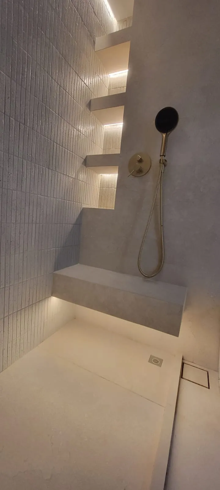 Finished shower detail with brass fixtures