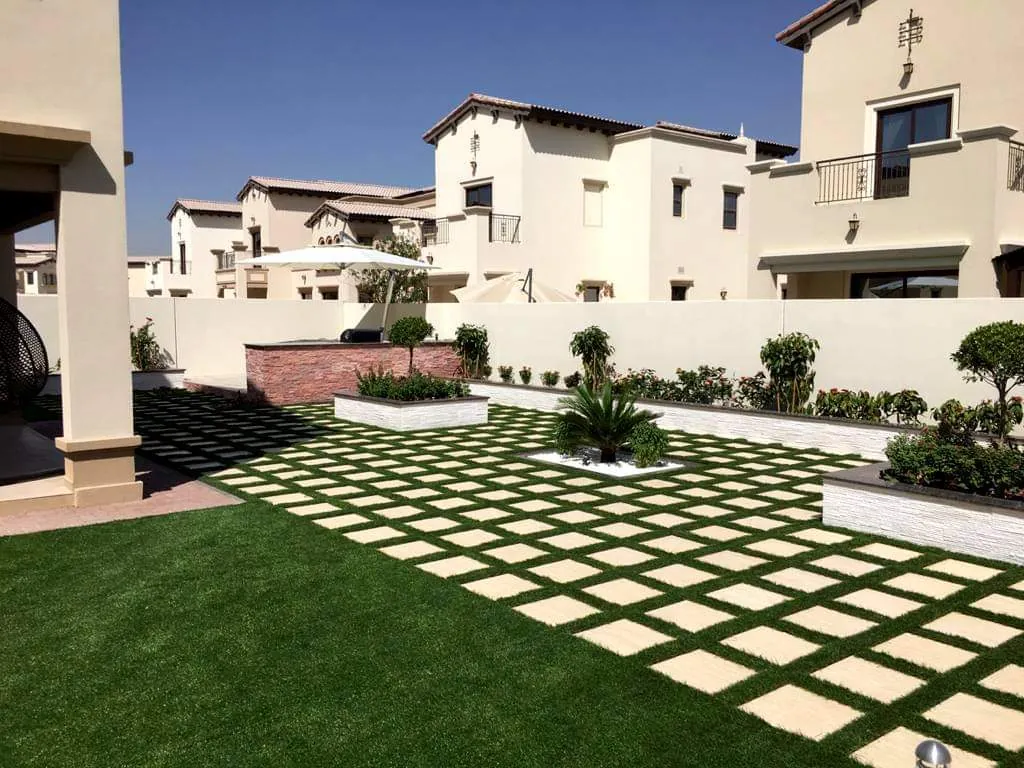 Landscaped Dubai villa garden with paver and lawn pattern