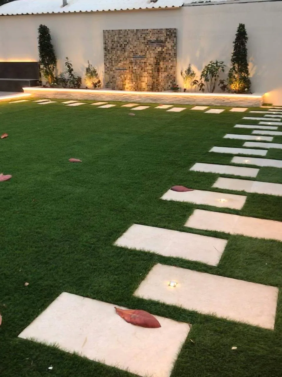 Dubai villa garden landscaping with feature lighting