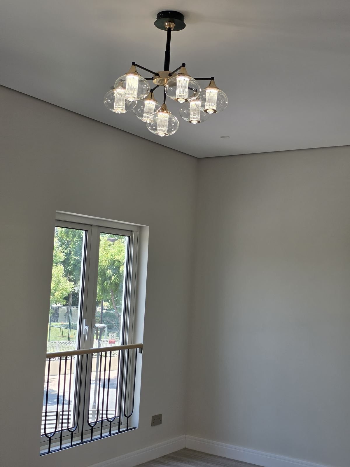 Finished room with chandelier installation