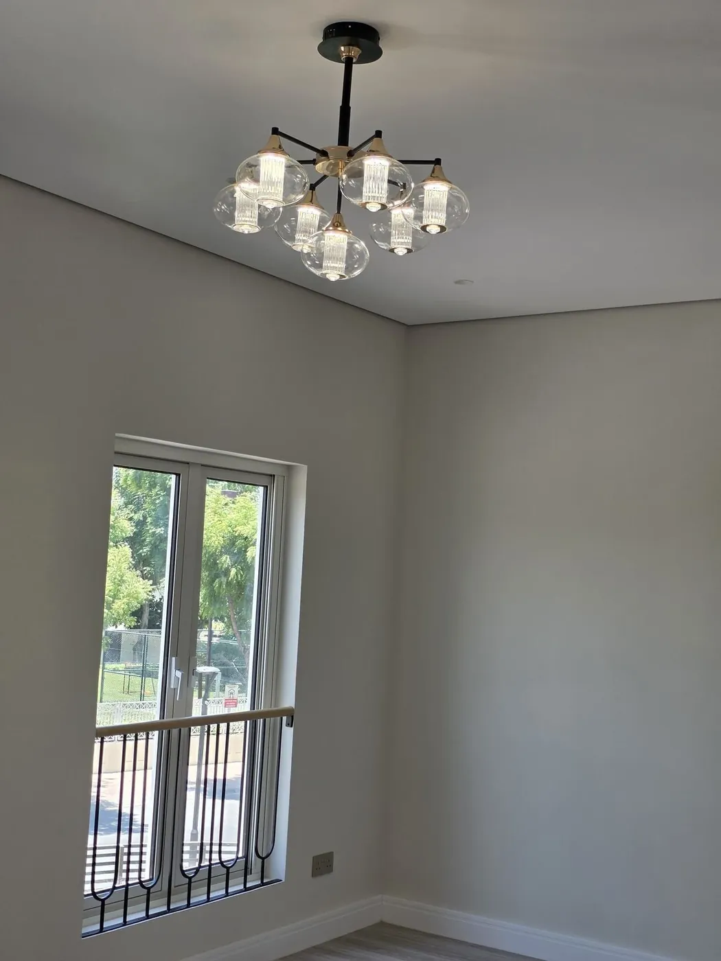Finished room with chandelier installation