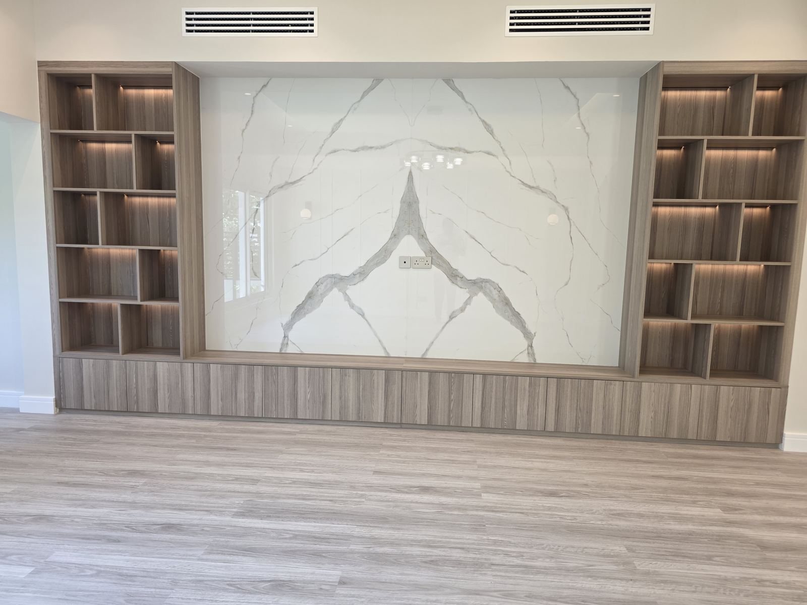 Custom TV wall unit with marble feature panel