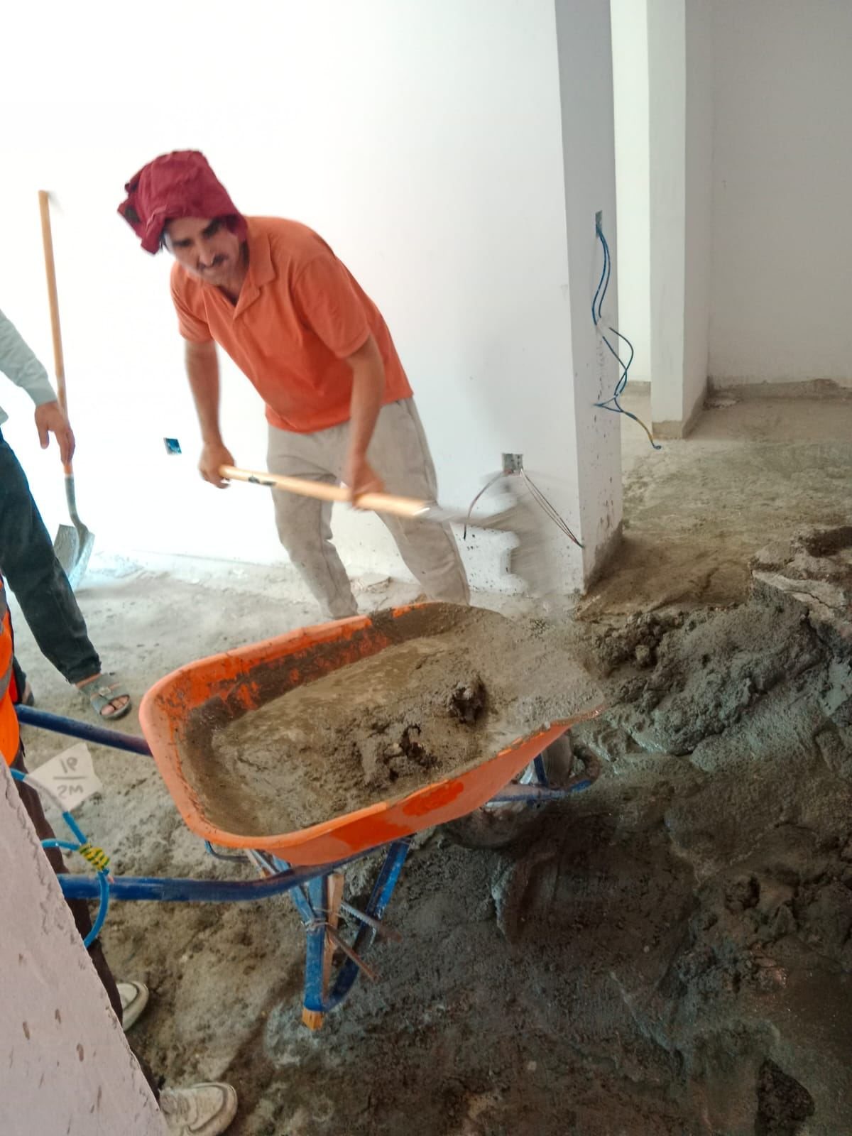 Fixmania team mixing cement on site
