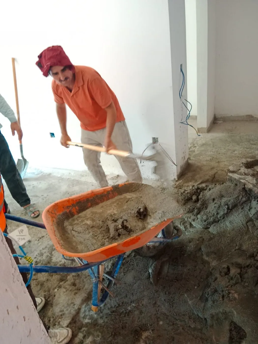 Fixmania team mixing cement on site