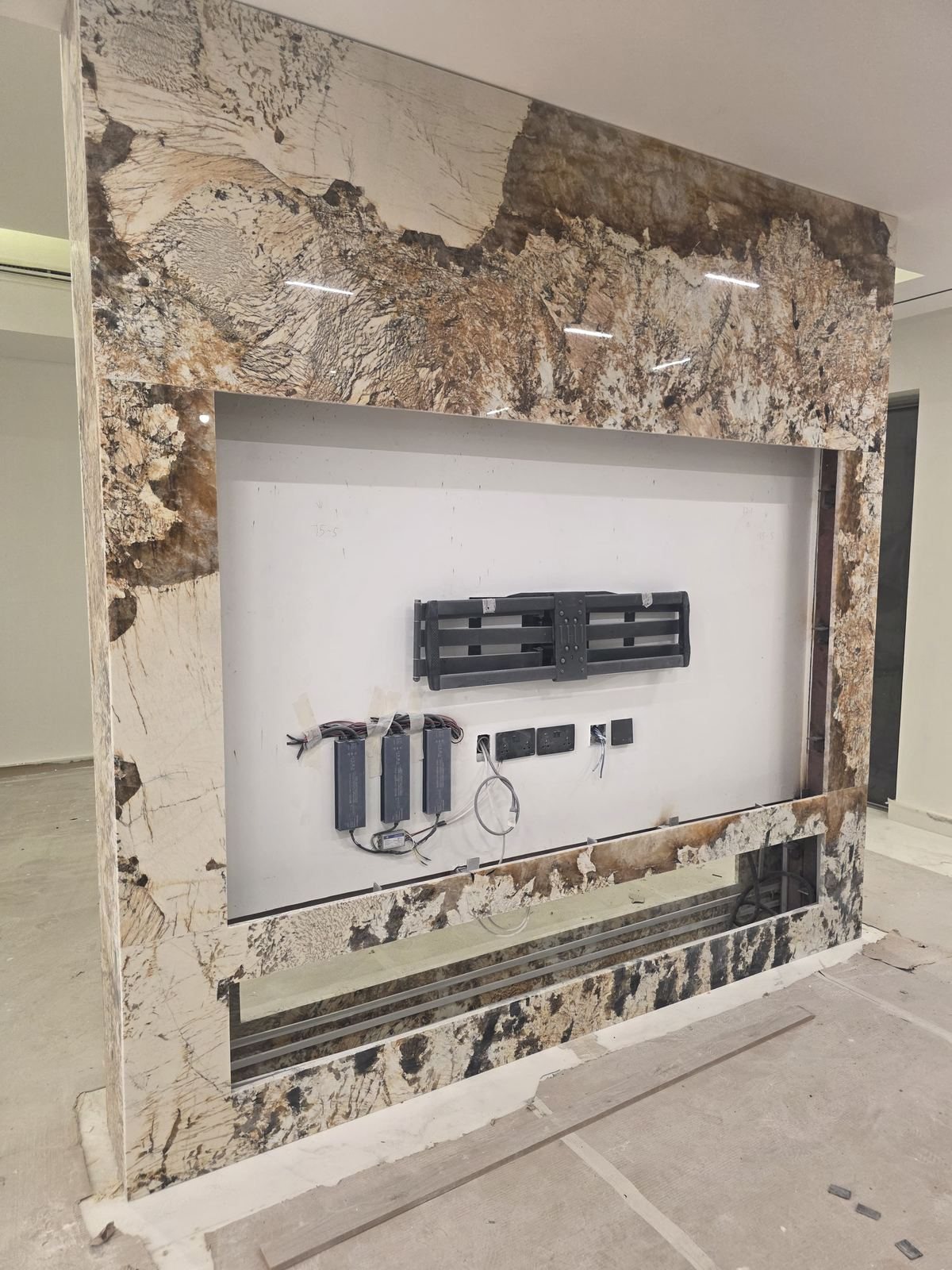 Custom granite feature wall with TV mount fit-out