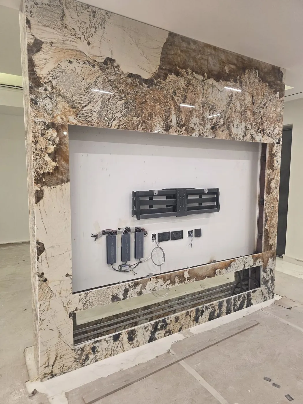 Custom granite feature wall with TV mount fit-out