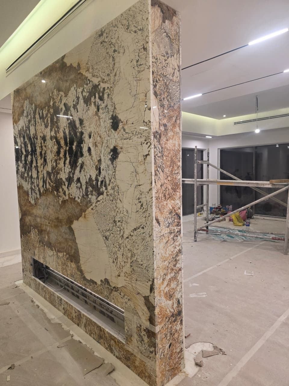 Granite feature column installation in villa living room