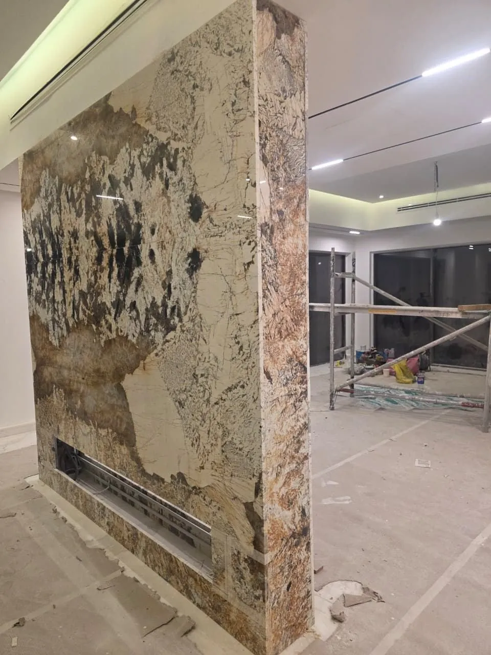 Granite feature column installation in villa living room