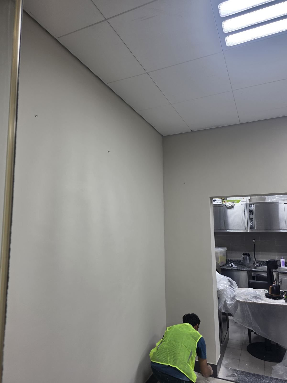 Ceiling and wall finishing work at café fit-out