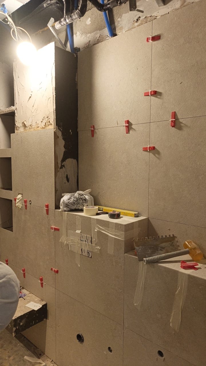 Bathroom wall and floor tiling in progress