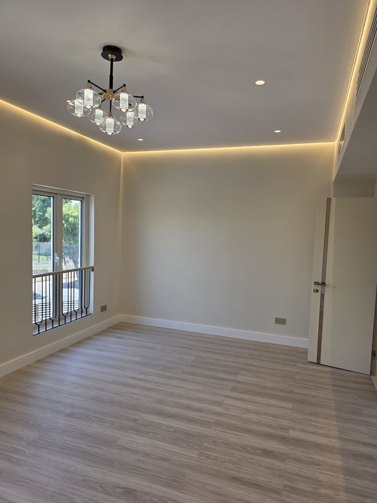 Finished room with new flooring and lighting