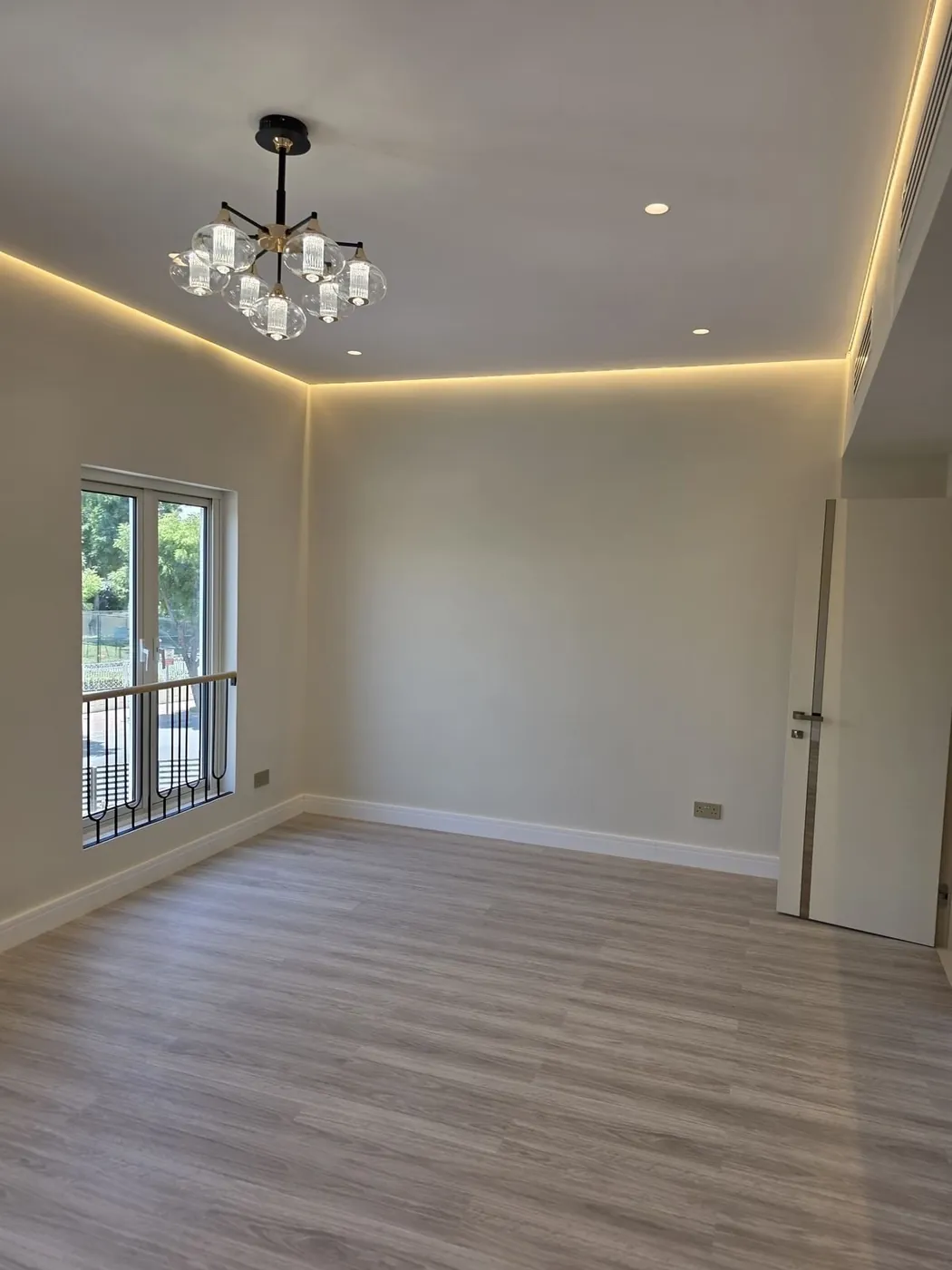 Finished room with new flooring and lighting