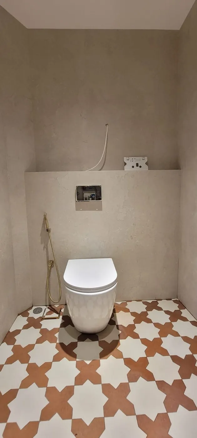 Toilet room with Moroccan star pattern floor tiling