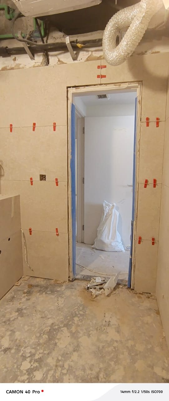 Doorway tiling installation in progress