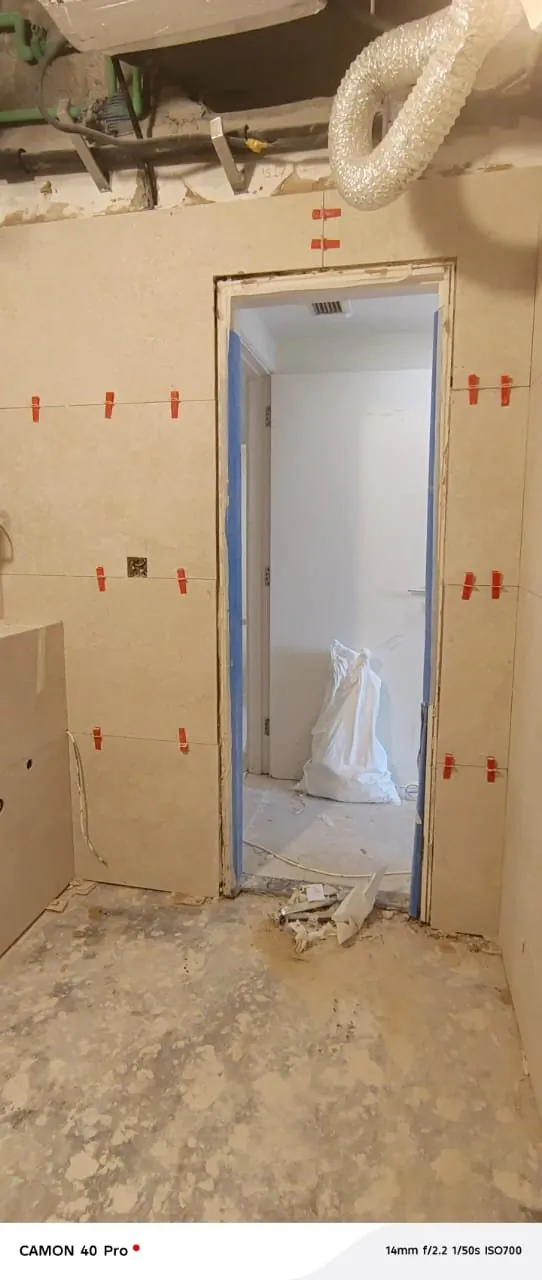 Doorway tiling installation in progress